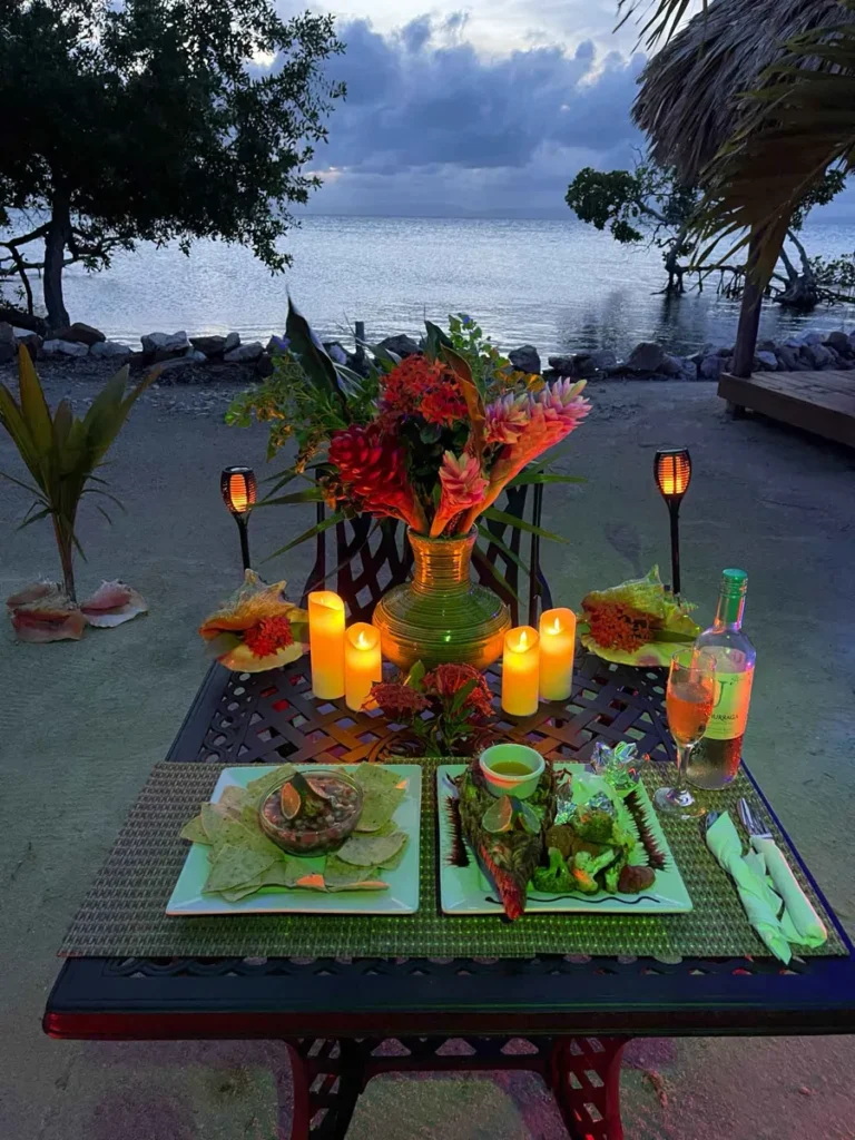 a bucketlist experience candle light dinner with nice decorations prepared by a private chef at the beach at little peter oasis, a private island rental in belize