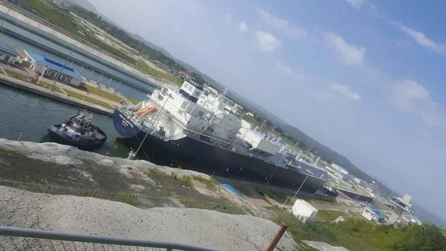 large cargo vessel in a narrow canal