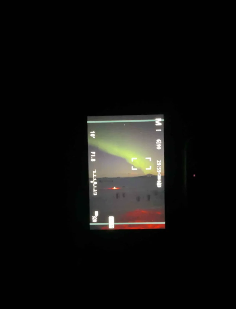 picture of a camera taking pictures of the northern lights