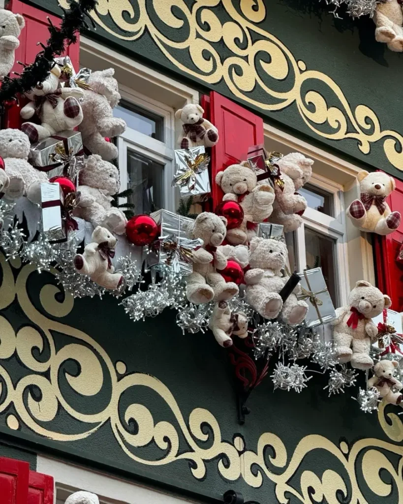 Green House facade with Christmas decorations made of teddy bears and glitter elements in Baden-Baden