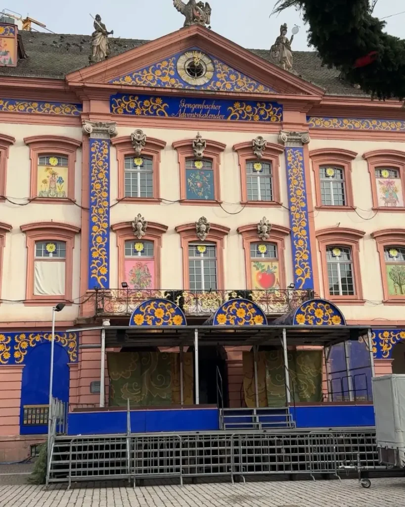 House facade with colourful paintings, each window with a number - the world's largest Adventcalendar in Gegenbach