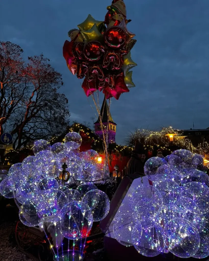 Partly illuminated balloons available for purchase at the christmas market in Lindau