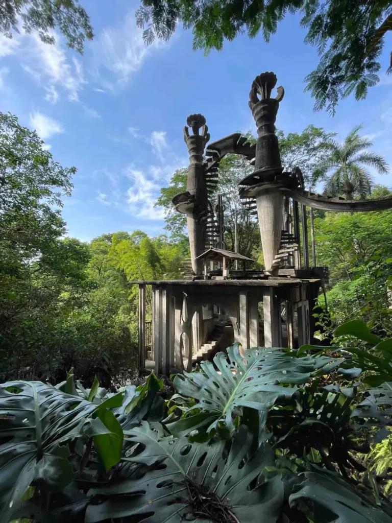 Las Pozas - the surreal gardens: a obscure building with spiral staircases two towers and many details within the mexican forest in San Luis Potosi Mexico