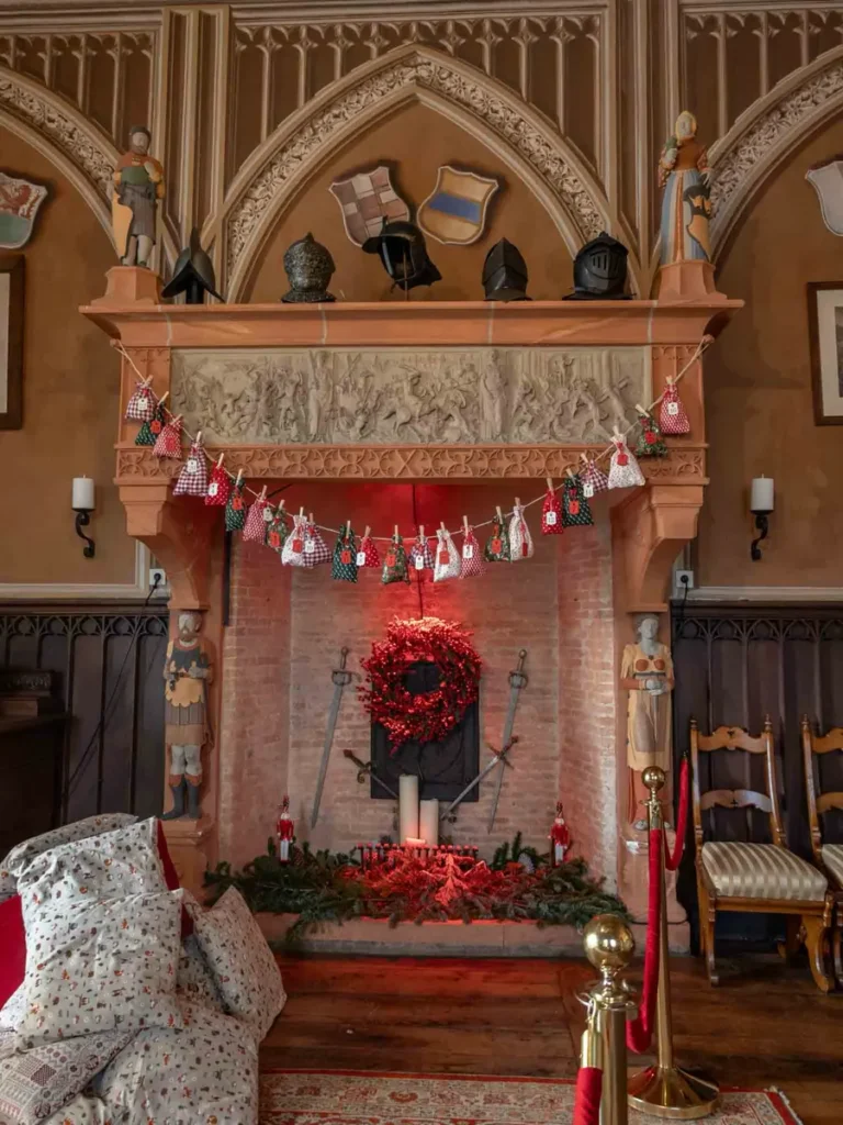 Festive Christmas decorations in a royal living room with a fire place in Burg Rheinstein