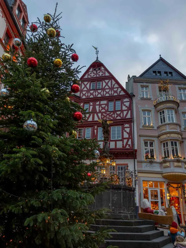 Christmas tree in front of traditional half-timbered houses in Bernkastel-Kues