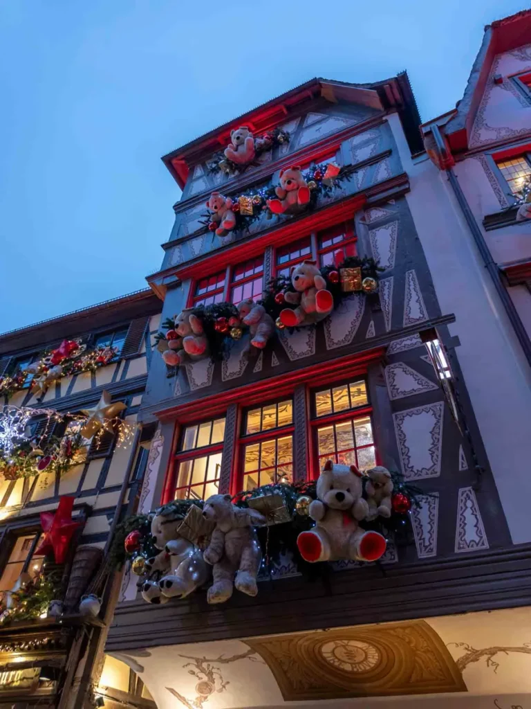 Half-timbered house decorated with teddy bears during Christmas in Alsace in Strasbourg