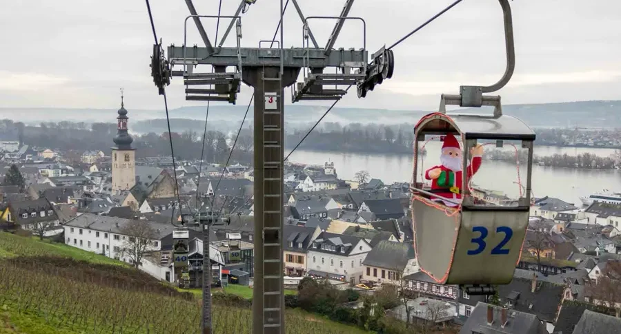 Views over the Rhine valley from a cable car with a Santa sitting in one of the cabins in Rüdesheim am Rhein