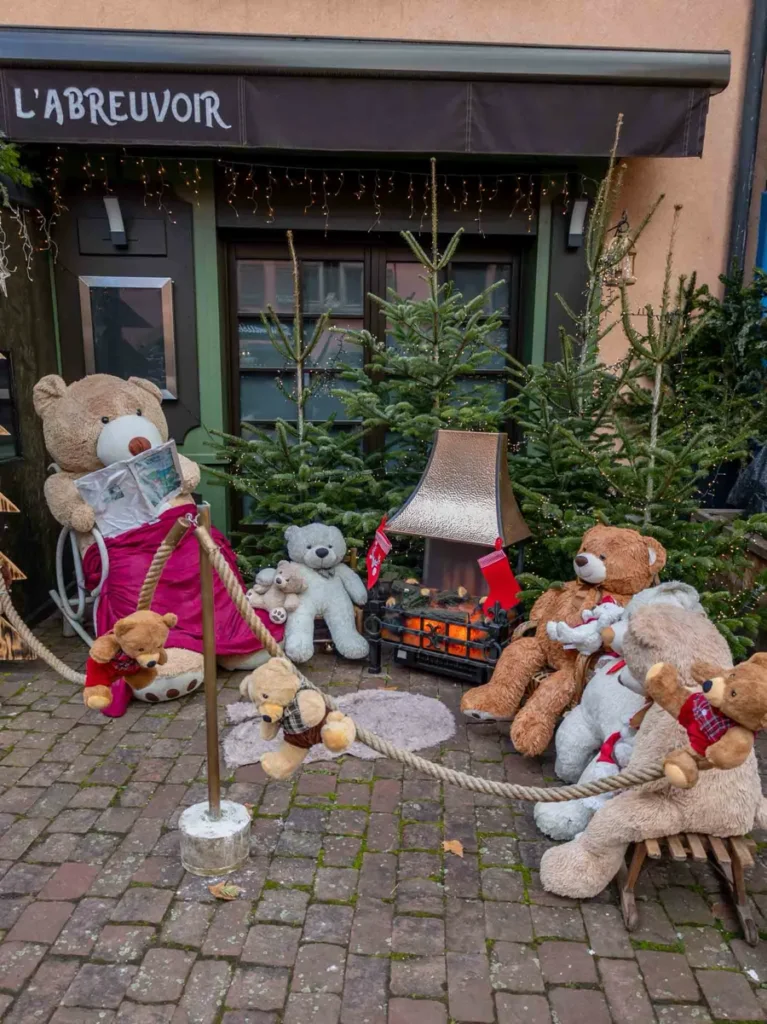 Teddy bears and Christmas decorations in front of a restaurant in the Alsace region in France